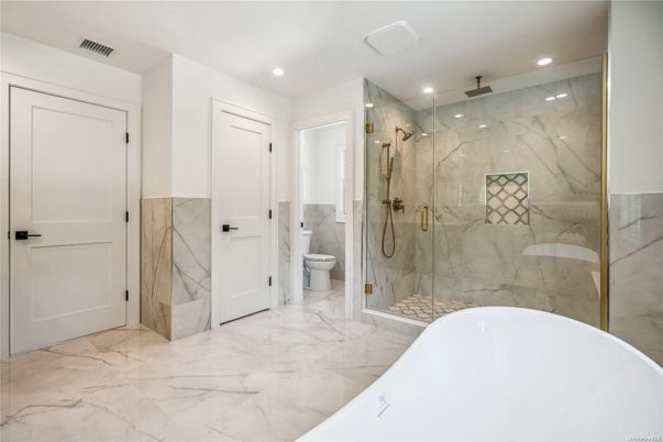 Bathroom, Free Standing Baths, Glass Shower, Interior, Marble, Marble Walls, Recessed Lighting