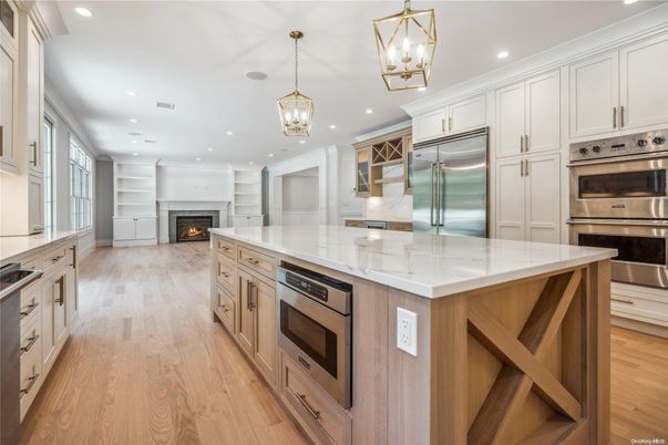 Fireplace, Interior, Kitchen, Pendant Lights, Recessed Lighting, Stainless Steel Appliances, Wood Texture Flooring