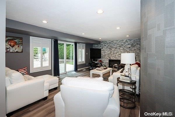 Fireplace, Interior, Living room, Recessed Lighting, Stone Walls, Wood Texture Flooring
