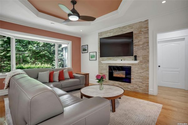 Fireplace, Interior, Living room, Recessed Lighting, Stone Walls, Wood Texture Flooring