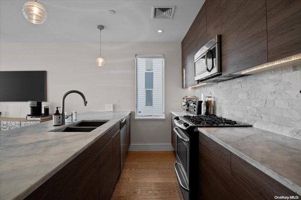 Interior, Kitchen, Marble Walls, Pendant Lights, Recessed Lighting, Wood Texture Flooring