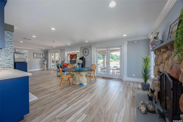 Dining room, Fireplace, Interior, Kitchen, Recessed Lighting, Wood Texture Flooring