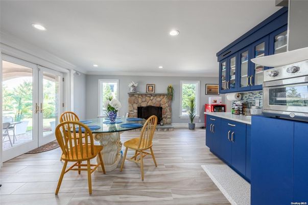 Dining room, Fireplace, Interior, Kitchen, Recessed Lighting, Wood Texture Flooring