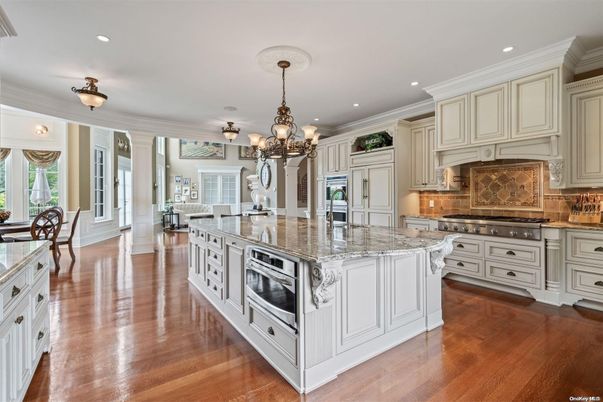 Chandelier, Dining room, Interior, Kitchen, Recessed Lighting, Stainless Steel Appliances, Wood Texture Flooring