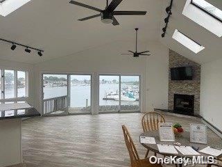Dining room, Fireplace, Interior, Pendant Lights, Stone Walls, Water, Wood Texture Flooring
