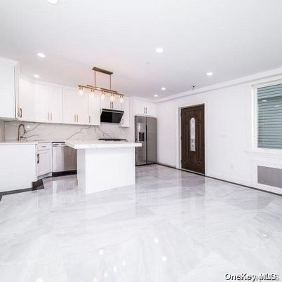 Interior, Kitchen, Marble, Marble Walls, Pendant Lights, Recessed Lighting, Stainless Steel Appliances