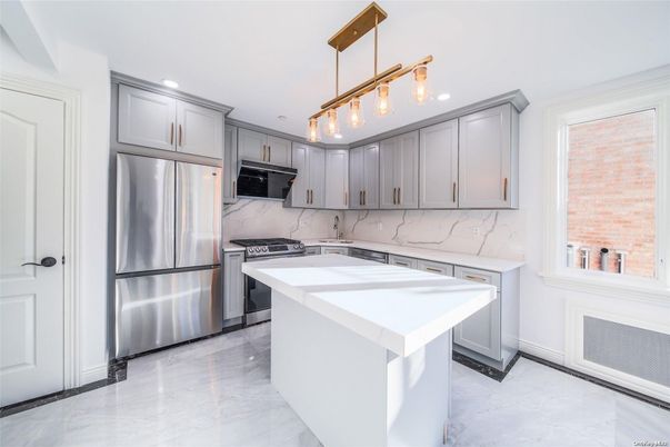 Interior, Kitchen, Marble, Marble Walls, Pendant Lights, Recessed Lighting, Stainless Steel Appliances
