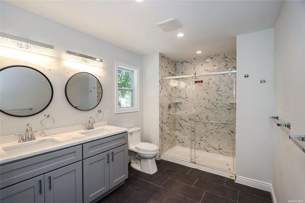 Bathroom, Dual Sink Vanities, Glass Shower, Interior, Marble Walls, Recessed Lighting