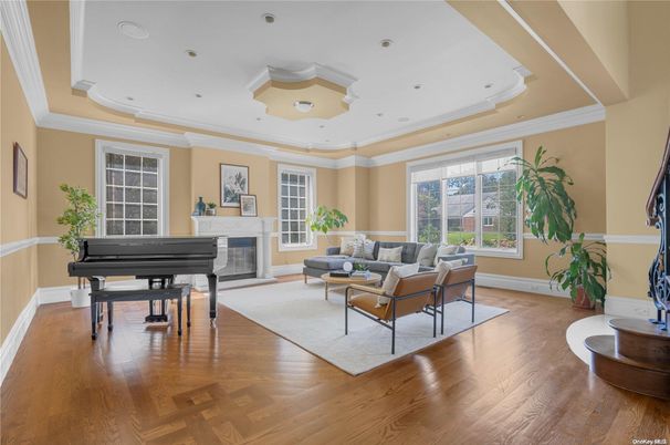 Fireplace, Interior, Living room, Piano, Recessed Lighting, Wood Texture Flooring
