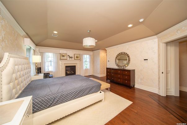 Bedroom, Fireplace, Interior, Pendant Lights, Recessed Lighting, Wood Texture Flooring