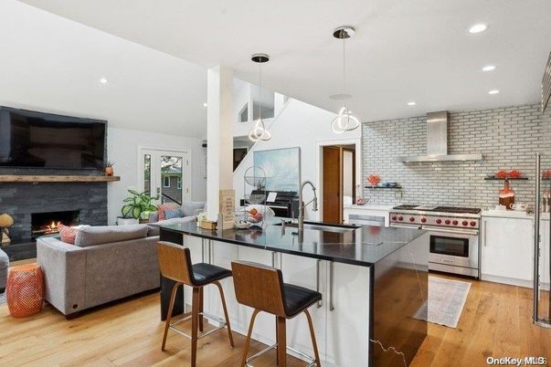 Fireplace, Interior, Kitchen, Living room, Pendant Lights, Recessed Lighting, Stainless Steel Appliances, Wood Texture Flooring
