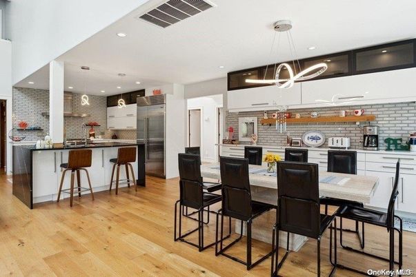 Interior, Kitchen, Pendant Lights, Recessed Lighting, Stainless Steel Appliances, Stone Walls, Wood Texture Flooring