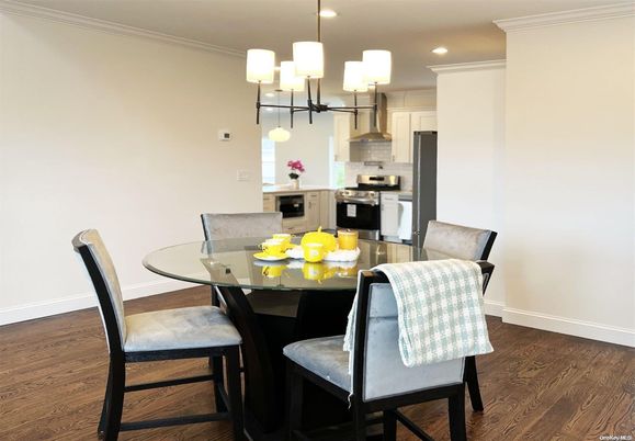 Chandelier, Dining room, Interior, Kitchen, Recessed Lighting, Stainless Steel Appliances, Wood Texture Flooring