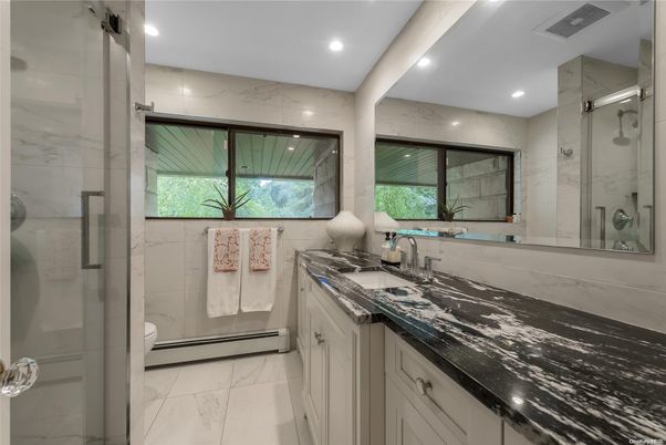 Bathroom, Dual Sink Vanities, Glass Shower, Interior, Marble, Marble Walls, Recessed Lighting