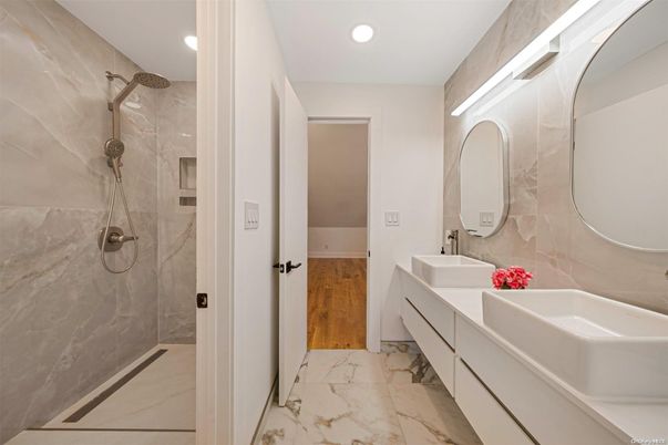 Bathroom, Dual Sink Vanities, Glass Shower, Interior, Marble, Marble Walls, Recessed Lighting