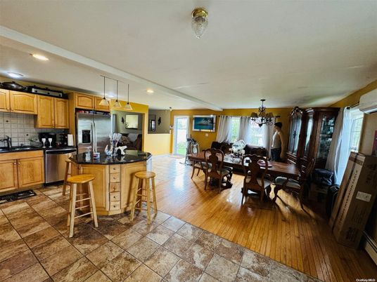 Chandelier, Dining room, Interior, Kitchen, Pendant Lights, Recessed Lighting, Stainless Steel Appliances, Wood Texture Flooring