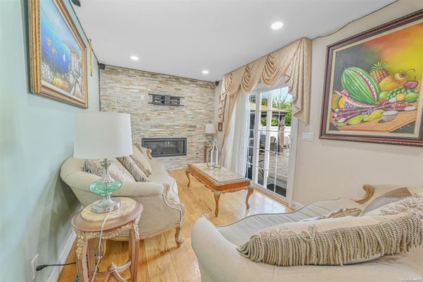 Fireplace, Interior, Living room, Recessed Lighting, Stone Walls, Wood Texture Flooring