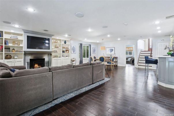 Dining room, Fireplace, Interior, Living room, Pendant Lights, Recessed Lighting, Wood Texture Flooring
