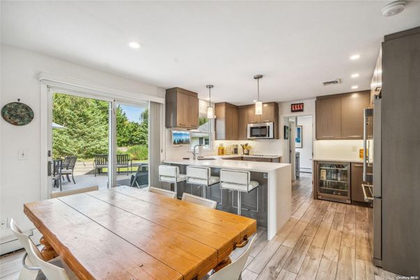 Dining room, Interior, Kitchen, Pendant Lights, Recessed Lighting, Stainless Steel Appliances, Wood Texture Flooring