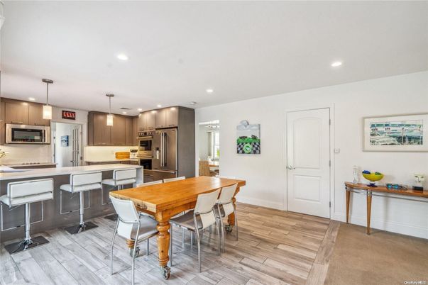 Dining room, Interior, Kitchen, Pendant Lights, Recessed Lighting, Stainless Steel Appliances, Wood Texture Flooring