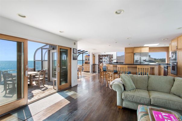 Dining room, Interior, Kitchen, Living room, Recessed Lighting, Stainless Steel Appliances, Water, Wood Texture Flooring