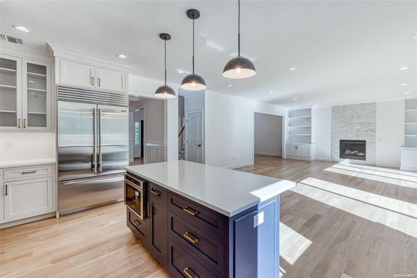 Fireplace, Interior, Kitchen, Pendant Lights, Recessed Lighting, Stainless Steel Appliances, Wood Texture Flooring