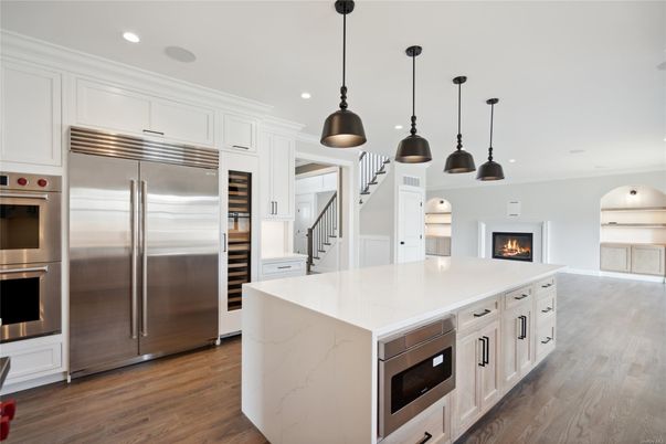 Fireplace, Interior, Kitchen, Pendant Lights, Recessed Lighting, Stainless Steel Appliances, Wood Texture Flooring