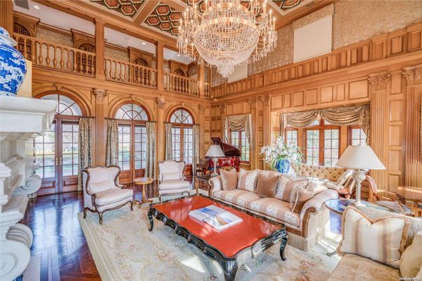 Chandelier, Fireplace, Interior, Living room, Recessed Lighting, Wood Texture Flooring, Wooden Walls