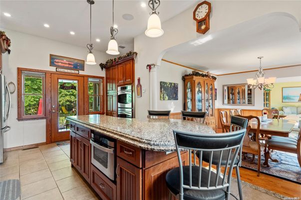 Chandelier, Dining room, Interior, Kitchen, Pendant Lights, Recessed Lighting, Stainless Steel Appliances, Wood Texture Flooring