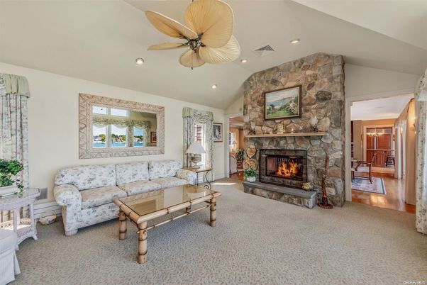 Fireplace, Interior, Living room, Recessed Lighting, Stone Walls, Wood Texture Flooring