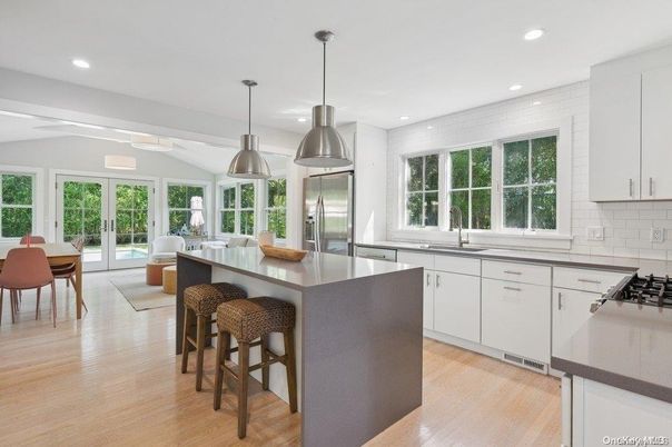 Dining room, Interior, Kitchen, Pendant Lights, Recessed Lighting, Stainless Steel Appliances, Wood Texture Flooring