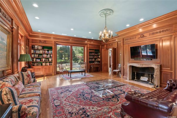 Chandelier, Fireplace, Interior, Living room, Recessed Lighting, Wood Texture Flooring, Wooden Walls