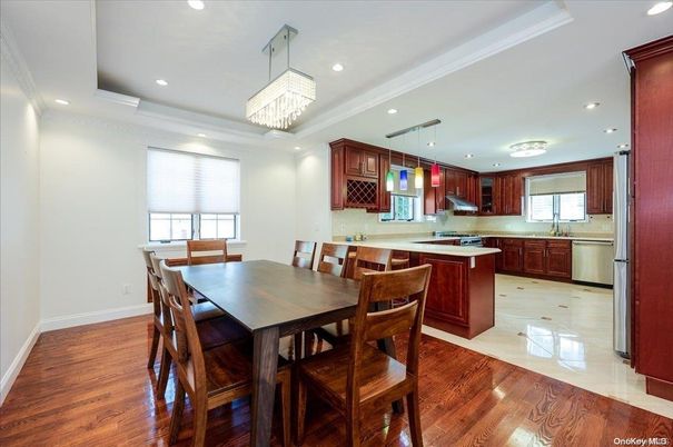 Chandelier, Dining room, Interior, Kitchen, Pendant Lights, Recessed Lighting, Stainless Steel Appliances, Wood Texture Flooring