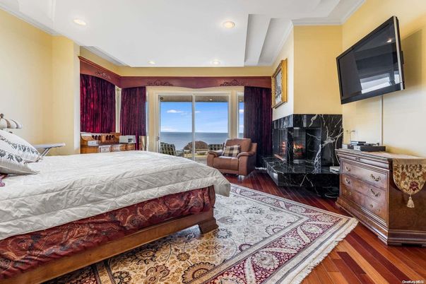 Bedroom, Fireplace, Interior, Recessed Lighting, Water, Wood Texture Flooring