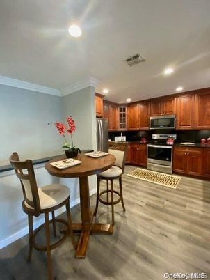 Dining room, Interior, Kitchen, Recessed Lighting, Stainless Steel Appliances, Wood Texture Flooring