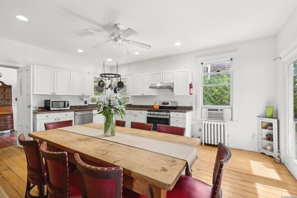 Dining room, Interior, Kitchen, Recessed Lighting, Stainless Steel Appliances, Wood Texture Flooring