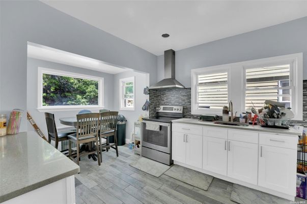 Dining room, Interior, Kitchen, Recessed Lighting, Stainless Steel Appliances, Wood Texture Flooring