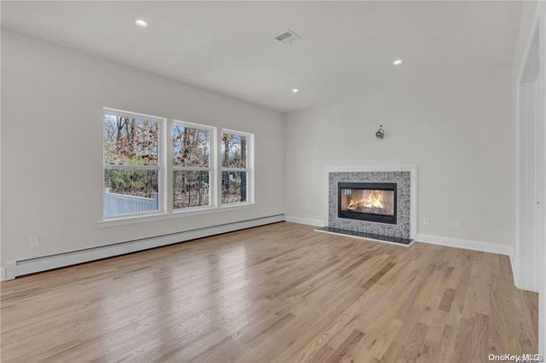 Empty room, Fireplace, Interior, Recessed Lighting, Wood Texture Flooring