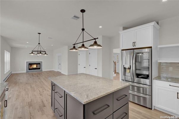 Fireplace, Interior, Kitchen, Pendant Lights, Recessed Lighting, Stainless Steel Appliances, Wood Texture Flooring