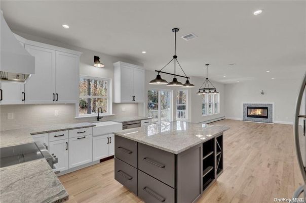 Fireplace, Interior, Kitchen, Pendant Lights, Recessed Lighting, Stainless Steel Appliances, Wood Texture Flooring