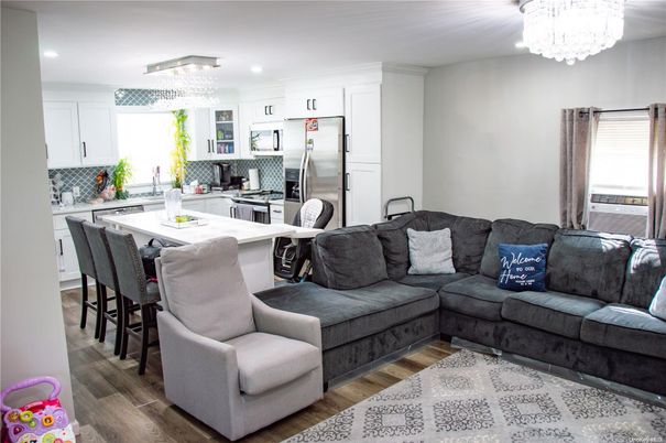 Chandelier, Interior, Kitchen, Living room, Recessed Lighting, Stainless Steel Appliances, Wood Texture Flooring