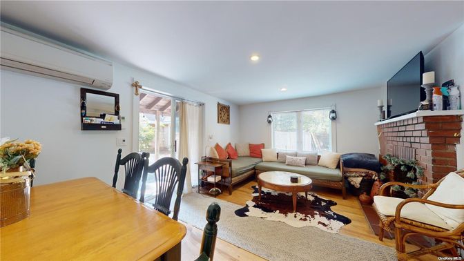 Dining room, Fireplace, Interior, Living room, Recessed Lighting, Wood Texture Flooring