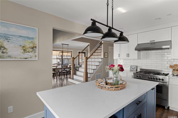 Chandelier, Dining room, Interior, Kitchen, Pendant Lights, Recessed Lighting, Stainless Steel Appliances, Wood Texture Flooring