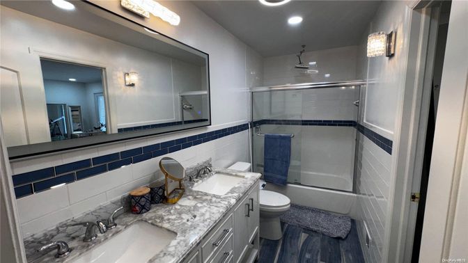 Bathroom, Dual Sink Vanities, Glass Shower, Interior, Recessed Lighting, Wood Texture Flooring