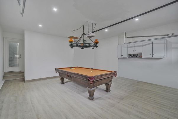 Billiard Table, Chandelier, Game Room, Interior, Pendant Lights, Recessed Lighting, Wood Texture Flooring