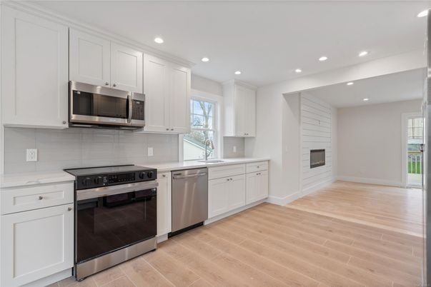 Interior, Kitchen, Recessed Lighting, Stainless Steel Appliances, Wood Texture Flooring