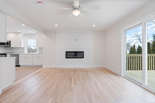 Empty room, Fireplace, Interior, Kitchen, Recessed Lighting, Wood Texture Flooring