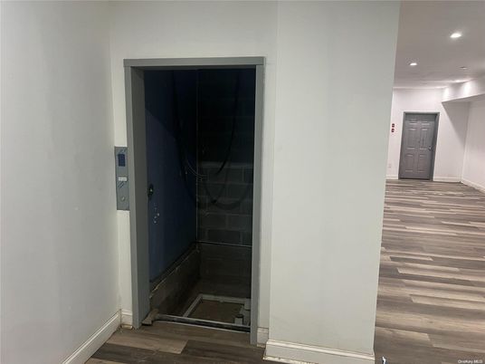 Elevator, Interior, Recessed Lighting, Wood Texture Flooring