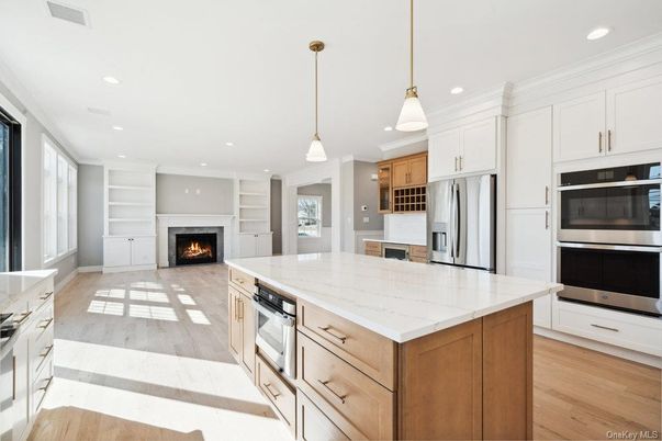 Fireplace, Interior, Kitchen, Pendant Lights, Recessed Lighting, Stainless Steel Appliances, Wood Texture Flooring