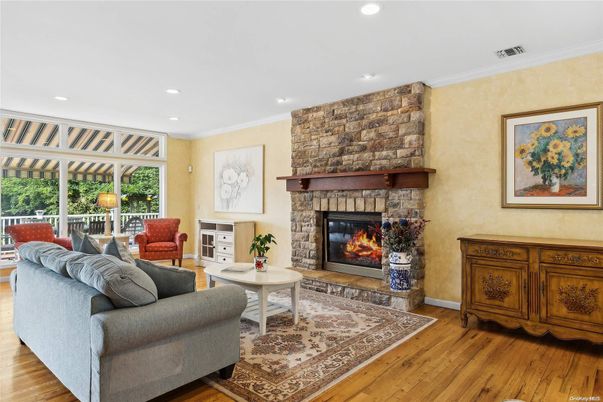 Fireplace, Interior, Living room, Recessed Lighting, Stone Walls, Wood Texture Flooring